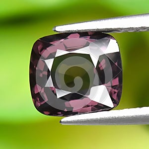 Natural gemstone pink spinel on gray background