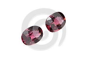 Natural gemstone rhodolite garnet isolated on white background