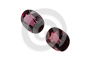 Natural gemstone rhodolite garnet isolated on white background