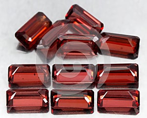 Natural gemstone rhodolite garnet isolated on the white background