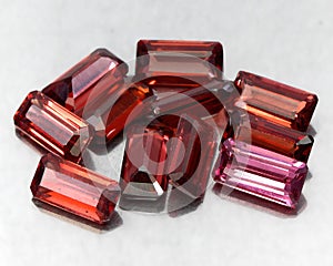 Natural gemstone rhodolite garnet isolated on the white background