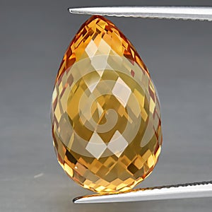Natural gemstone yellow citrine on gray background