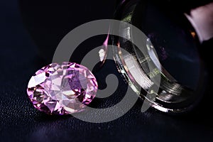 natural genuine mined pink sapphire oval cutting shape gemstone on black