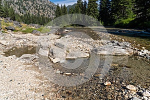 Natural geothermal hot spring in Idaho - Sacajawea Hot Springs in Grandjean. Large stones arranged in a circle to protect the hot photo