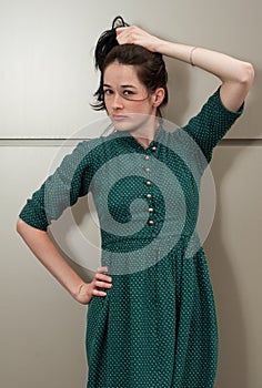 Natural girl with a green dress and white dots