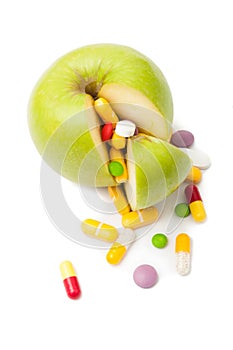 Natural green apple and various pills