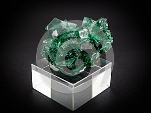 Natural green fluorite mineral on black background