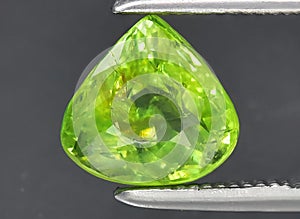 natural green garnet grossular gem on the background