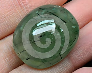 natural green prehnite gem on the background photo