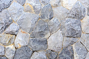 Natural grey stone wall, concept for background texture.