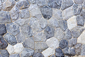 Natural grey stone wall, concept for background texture.