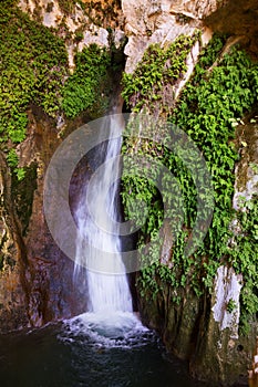 Natural grot with waterfall photo