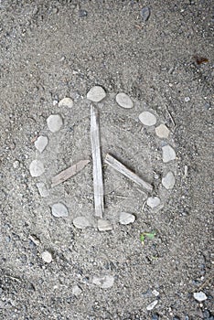 Natural handmade peace sign made on the ground in dirt