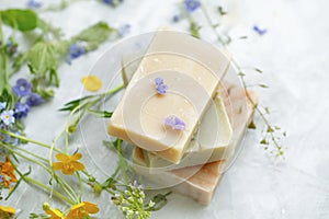 Natural handmade soap bars with organic medicinal plants and flowers.Homemade beauty products with natural essential oils from photo