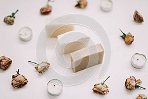 Natural handmade Soap in a frame of flowers on white background. Flat lay, top view mockup copy space template.