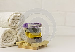 Natural handmade soap. Pieces of multicolored soap made of natural materials on the table