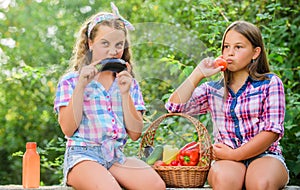 Natural harvest. Happy sisters garden. Organic harvest. Farm market. Selling homegrown food concept. Girls cute children