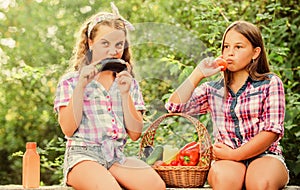 Natural harvest. Happy sisters garden. Organic harvest. Farm market. Selling homegrown food concept. Girls cute children