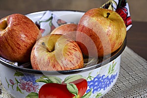 Natural and healthy tropical fruit apple in the bowl on the table on blurred texture background