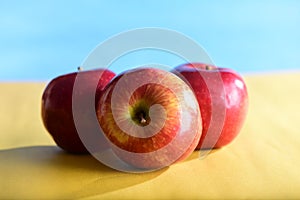 natural and healthy tropical fruit apples on the table on white texture background