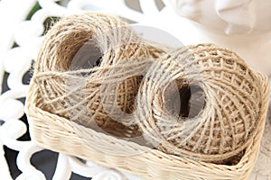 Natural hemp rope on basket, selective focus