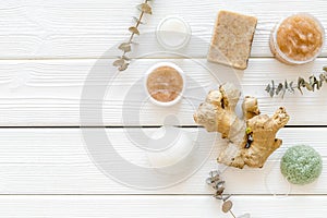 Natural herbal cosmetics with ginger on white wooden background top view space for text