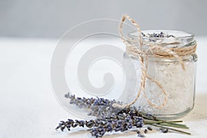 Natural herbal sea salt with aromatic lavender - perfect for relaxation. Cosmetic jars and bottles with salt, lavender