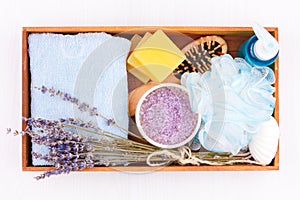 Natural herbal spa cosmetics with lavender extract - soap, salt, towel, massage brush, washcloth