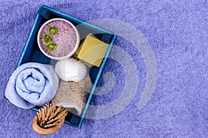 Natural herbal spa cosmetics with lavender extract - soap, salt, towel, massage brush, washcloth