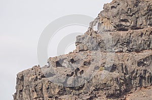 Natural hole in a sea cliff