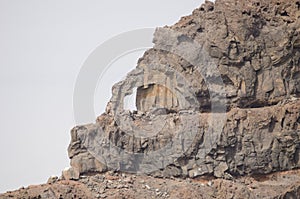 Natural hole in a sea cliff