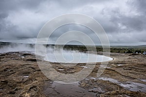 Natural Hot Springs geyser in Iceland with Steam