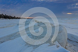 Natural Ice Sculptures on a Frozen Lake Huron at Sunset