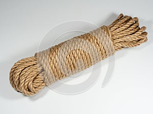 Natural jute twine roll on white background