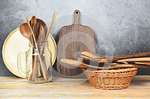 Natural kitchen tools wood products / Kitchen utensils background with spoon fork chopsticks plate cutting board object utensil