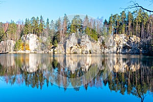 Natural lake in Adrspach rocks on sunny autumn day. Adrspach-Teplice sandstone rock town, Czech Republic