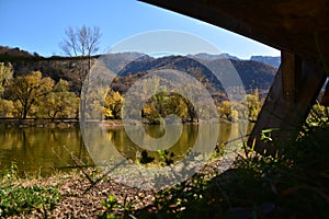 Natural lake and autumn forest at the top of the mountains