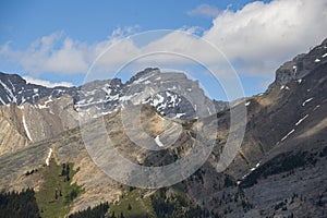 Natural landscape - Bow River Valley, Rocky Mountains, coniferous forest and beautiful sky with clouds.