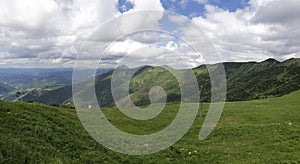 Natural landscape in the foothills of the High Tatras in the north of Slovakia in early summer with wide valleys and green meadows