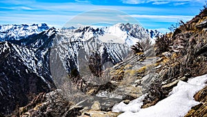 Natural landscape mountain panorama. Picturesque View Of The Snow-Capped Mountains Against A Clear Sky with clouds.