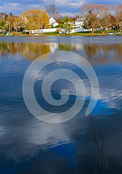 Natural Landscape, Reflection of clouds and lodges in the water of a quiet lake in New Jersey