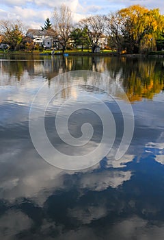 Natural Landscape, Reflection of clouds and lodges in the water of a quiet lake in New Jersey