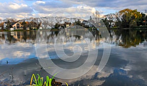 Natural Landscape, Reflection of clouds and lodges in the water of a quiet lake in New Jersey