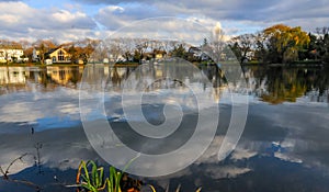 Natural Landscape, Reflection of clouds and lodges in the water of a quiet lake in New Jersey