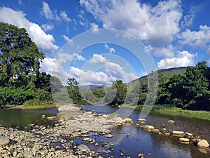 Natural landscape with river and clouds. Paisaje natural con rÃÂ­o y nubes photo