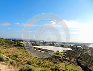 Natural landscape top view of the kibbutz agricultural farm and the Mediterranean Sea, Israel.