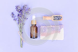 Natural lavender self-care products - cosmetic lavender oil or face serum and handmade soap