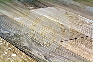 Natural light brown wooden parquet floor boards. Sunny soft yellow texture, copy space perspective background