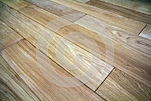 Natural light brown wooden parquet floor boards. Sunny soft yellow texture, copy space perspective background