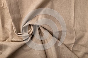 Natural linen fabric texture. Flaxen circular spiral textile background